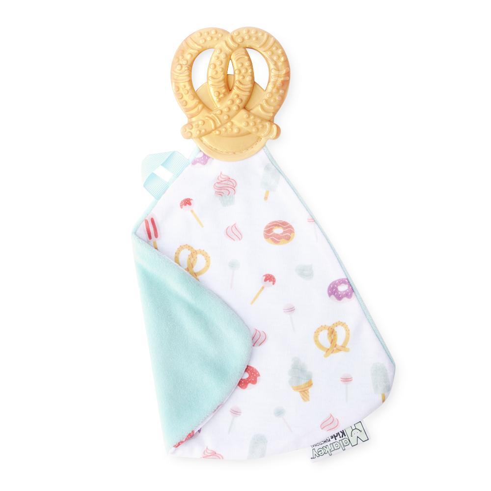 sweet and salty Munch-It Blanket- a convenient teether and cozy blanket for baby. Designed to target baby's emerging front& eye teeth as well as early molars.  The soft blanket is perfect for snuggling and absorbing drool